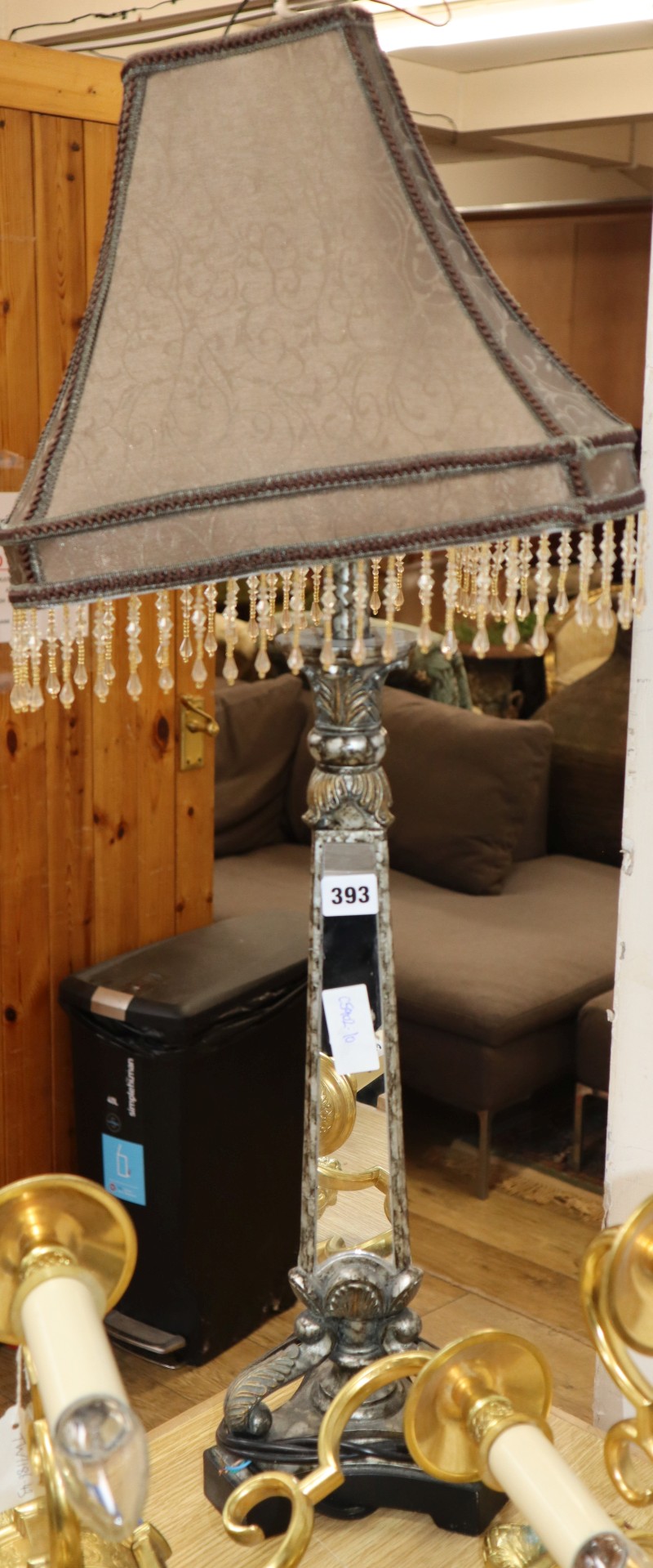 A gilt and silvered metal table lamp with mirrored triangular column